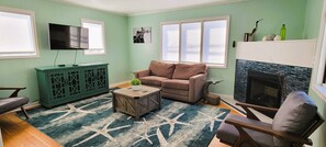 Family Cottage, 1 Bedroom, Non Smoking | Living area | Flat-screen TV, DVD player