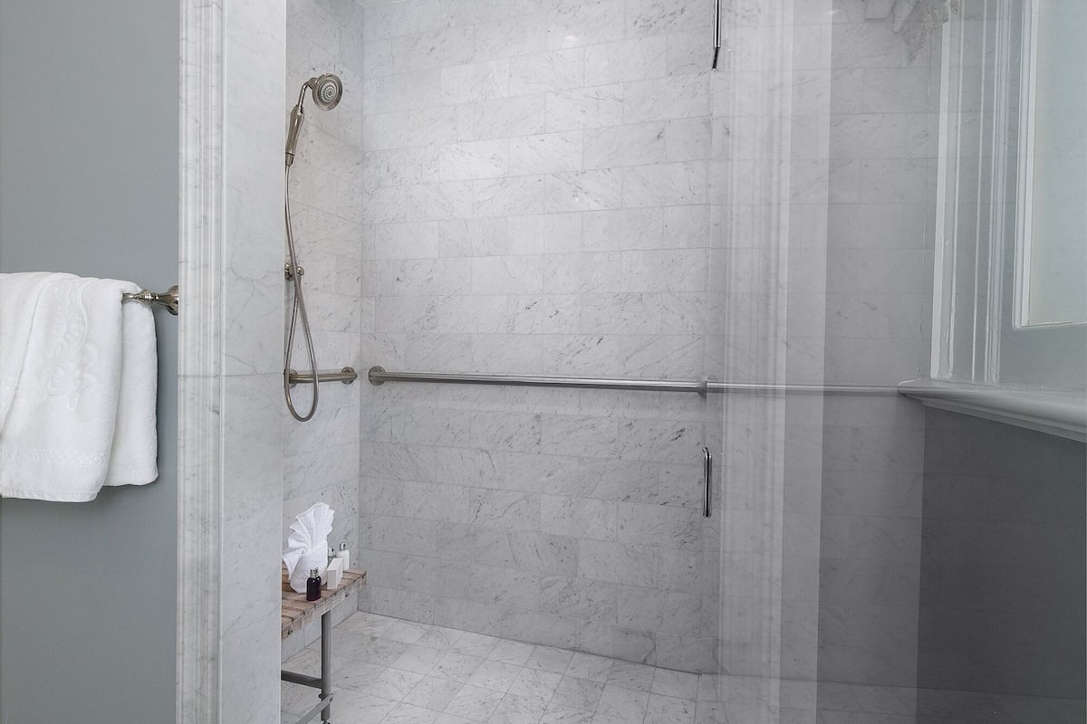 designer toiletries, hair dryer, bathrobes, slippers