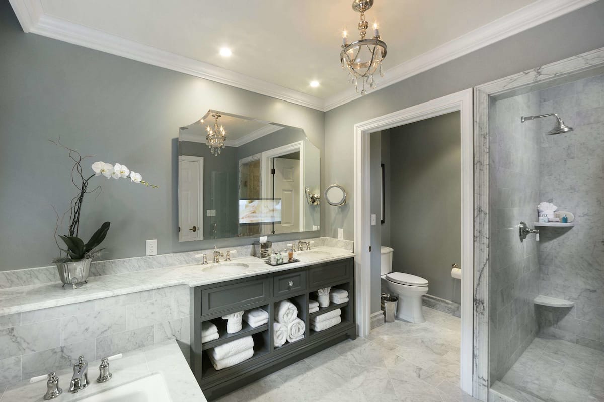 designer toiletries, hair dryer, bathrobes, slippers