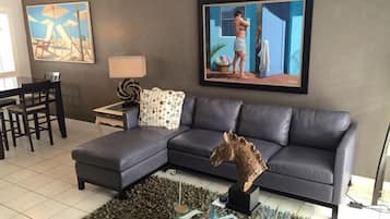 Elite Studio Suite, 1 King Bed (Room 106) | Living area | Flat-screen TV, DVD player, pay movies