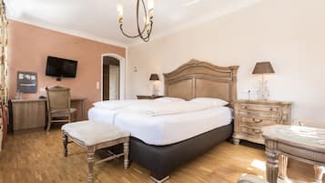 Luxe beddengoed, een minibar, een kluis op de kamer, een bureau