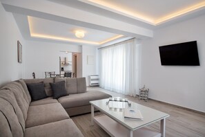 Apartment, 2 Bedrooms, Hot Tub, Ground Floor | Living room | 32-inch flat-screen TV with satellite channels, LCD TV, DVD player - Sienna Eco Resort (Santorini)