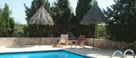 Outdoor pool, pool umbrellas, pool loungers