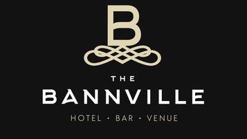A logo with a stylized 'B' and intertwined lines, followed by the text 'THE BANNVILLE HOTEL โข BAR โข VENUE'.