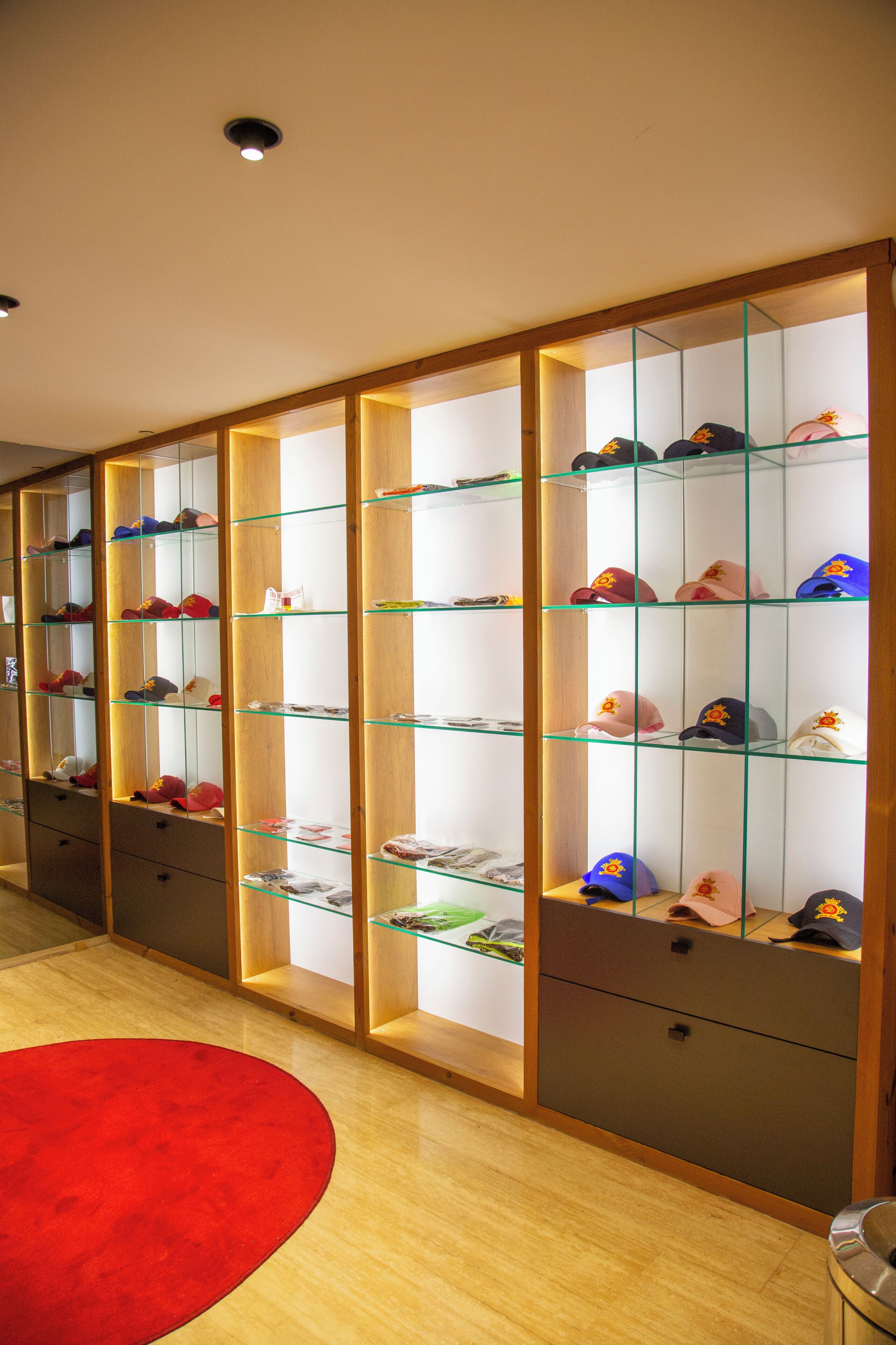 A shoe display with multiple shelves and drawers.