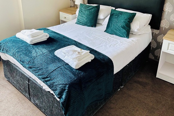 Double Room | Desk, blackout drapes, WiFi (free), bed sheets