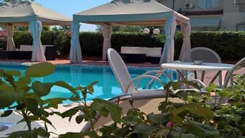 Outdoor pool, pool umbrellas, pool loungers