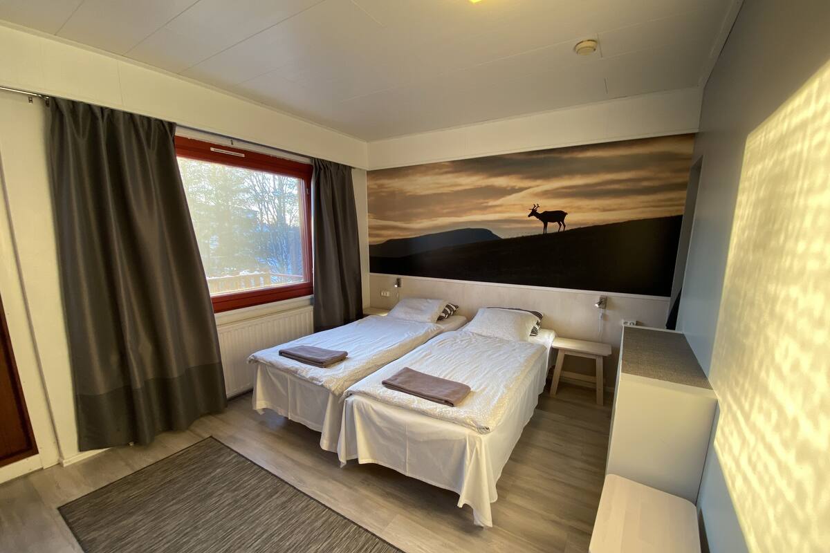 Triple Room | Desk, blackout drapes, WiFi (free), bed sheets
