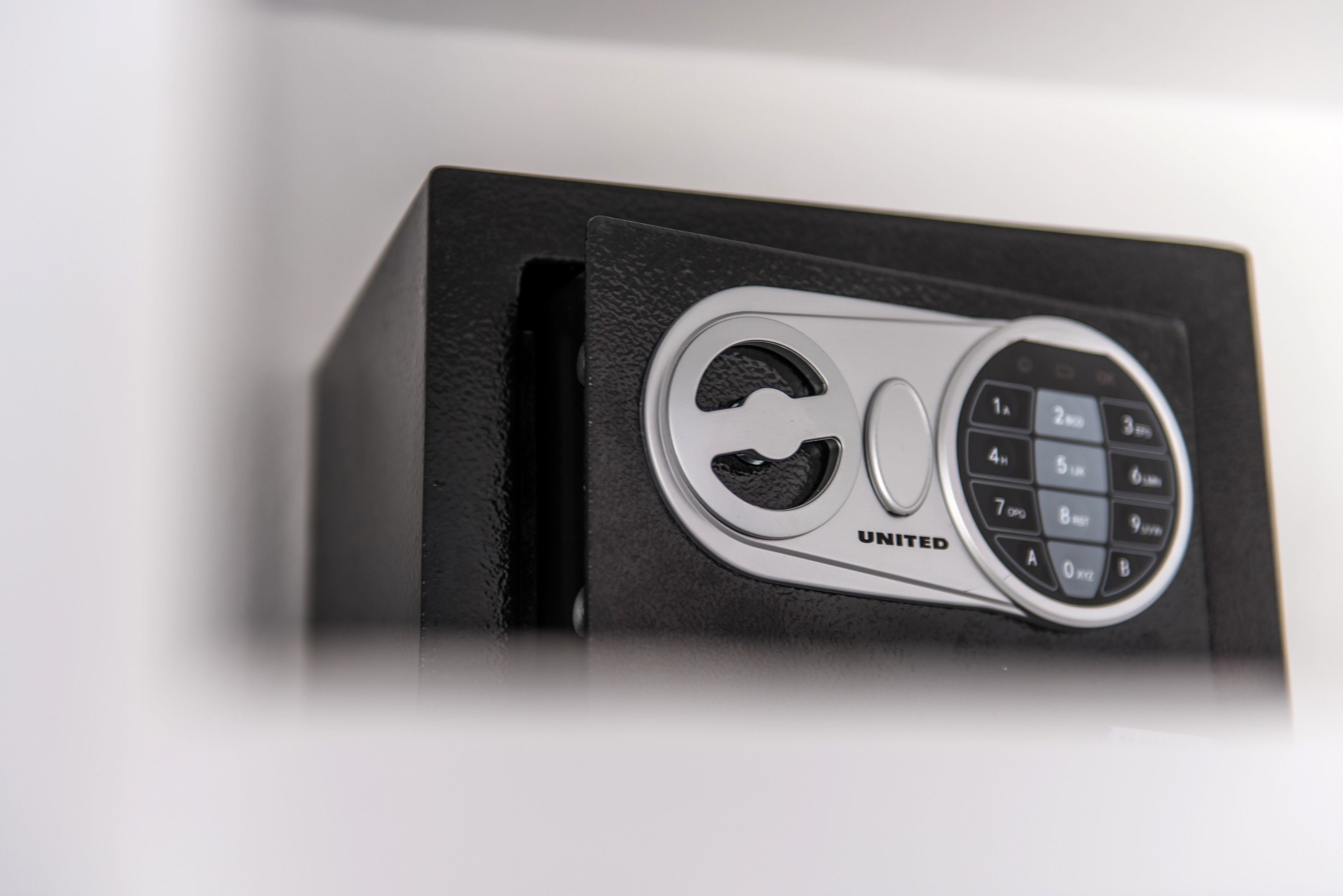 A black box with a silver keypad and the word "UNITED" on it.