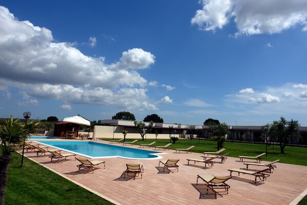 Seasonal outdoor pool, open 9 AM to 6 PM, pool umbrellas, sun loungers