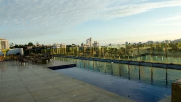 Outdoor pool, open 8:00 AM to 10:00 PM, pool loungers