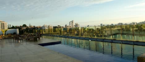 Outdoor pool, open 8:00 AM to 10:00 PM, pool loungers