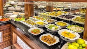 A buffet with various food items including fruits, salads, and other dishes. - The Conforium Hotel (Istanbul)