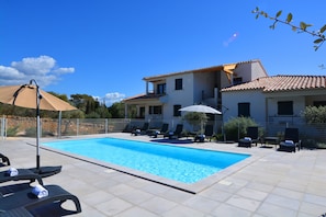 Outdoor pool, pool umbrellas, pool loungers