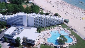 A hotel with a pool area, multiple swimming pools, and a beach. - Hotel Laguna Garden (Albena)