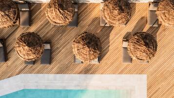 Seasonal outdoor pool, open 9:00 AM to 7:00 PM, pool umbrellas