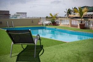 Outdoor pool, open 8 AM to 7 PM, pool loungers
