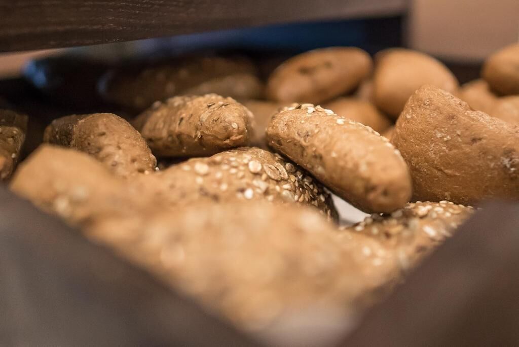 A close-up of sesame and poppy seeds on bread.