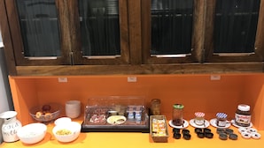 A breakfast buffet with various food items and condiments. - Le Strasbourg Hotel (Montpellier)