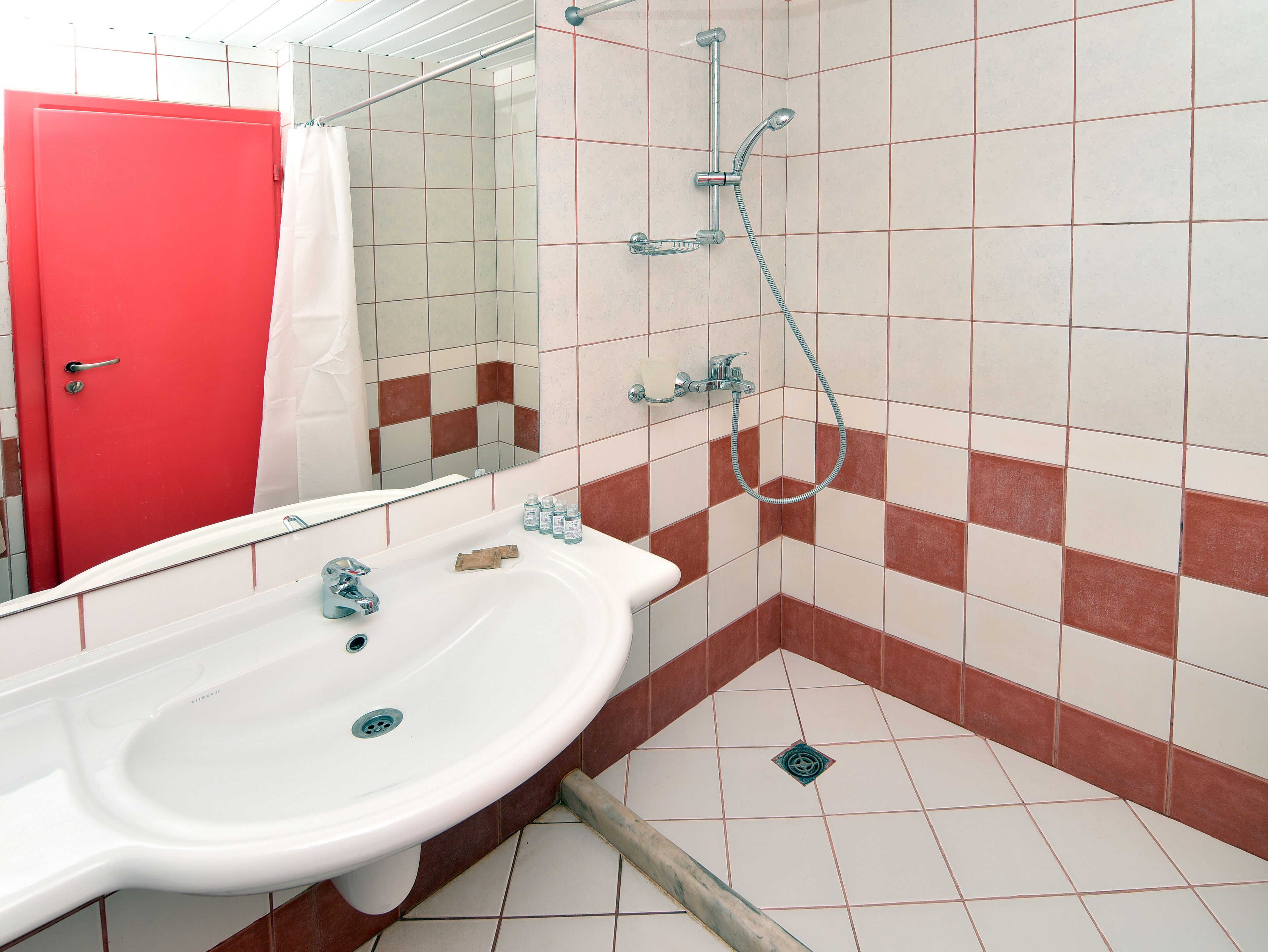 shower, hair dryer, slippers, towels