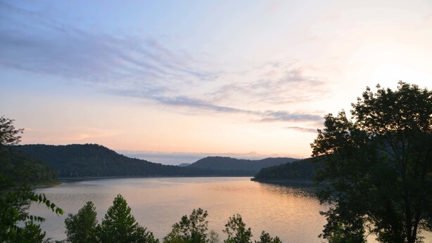 A serene lake surrounded by hills and trees. - The Retreat at Center Hill Lake (Smithville)