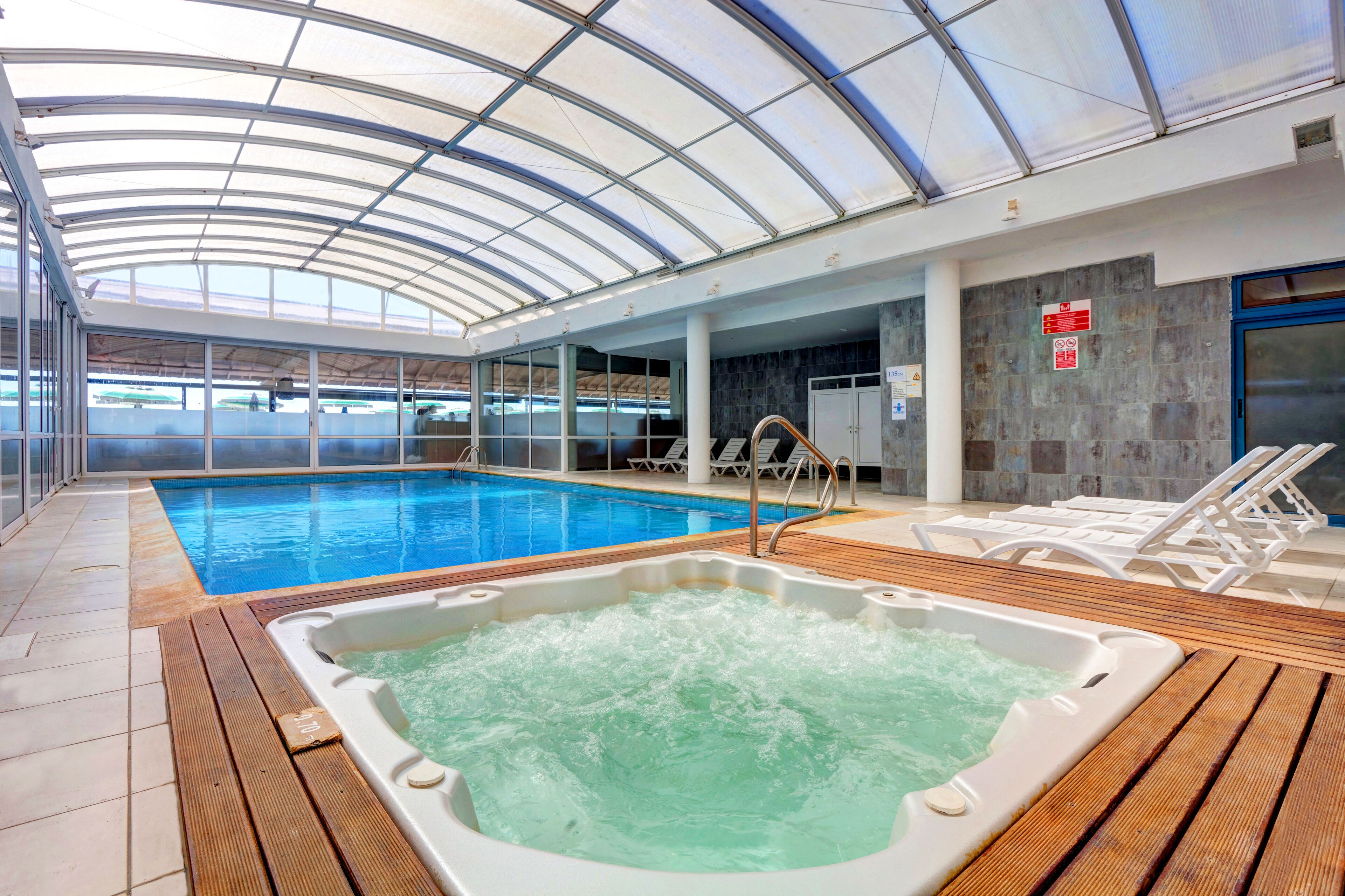 Indoor pool, seasonal outdoor pool, pool umbrellas, sun loungers