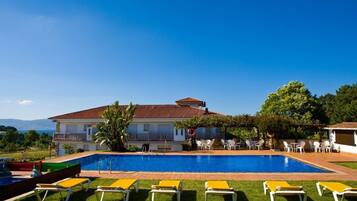 Indoor pool, seasonal outdoor pool, pool umbrellas, pool loungers