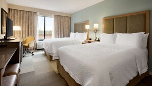 A hotel room with two beds, a desk, a chair, and a TV. - Hampton Inn & Suites Monroe (Monroe)