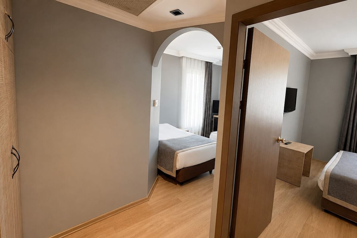 Family Room | Minibar, in-room safe, free WiFi, bed sheets