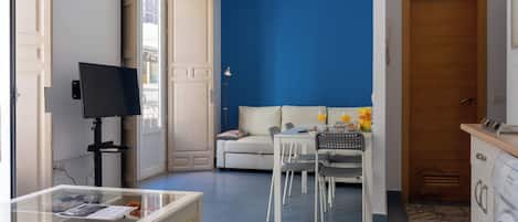 Apartment, 1 Bedroom, Balcony | Living room | Flat-screen TV