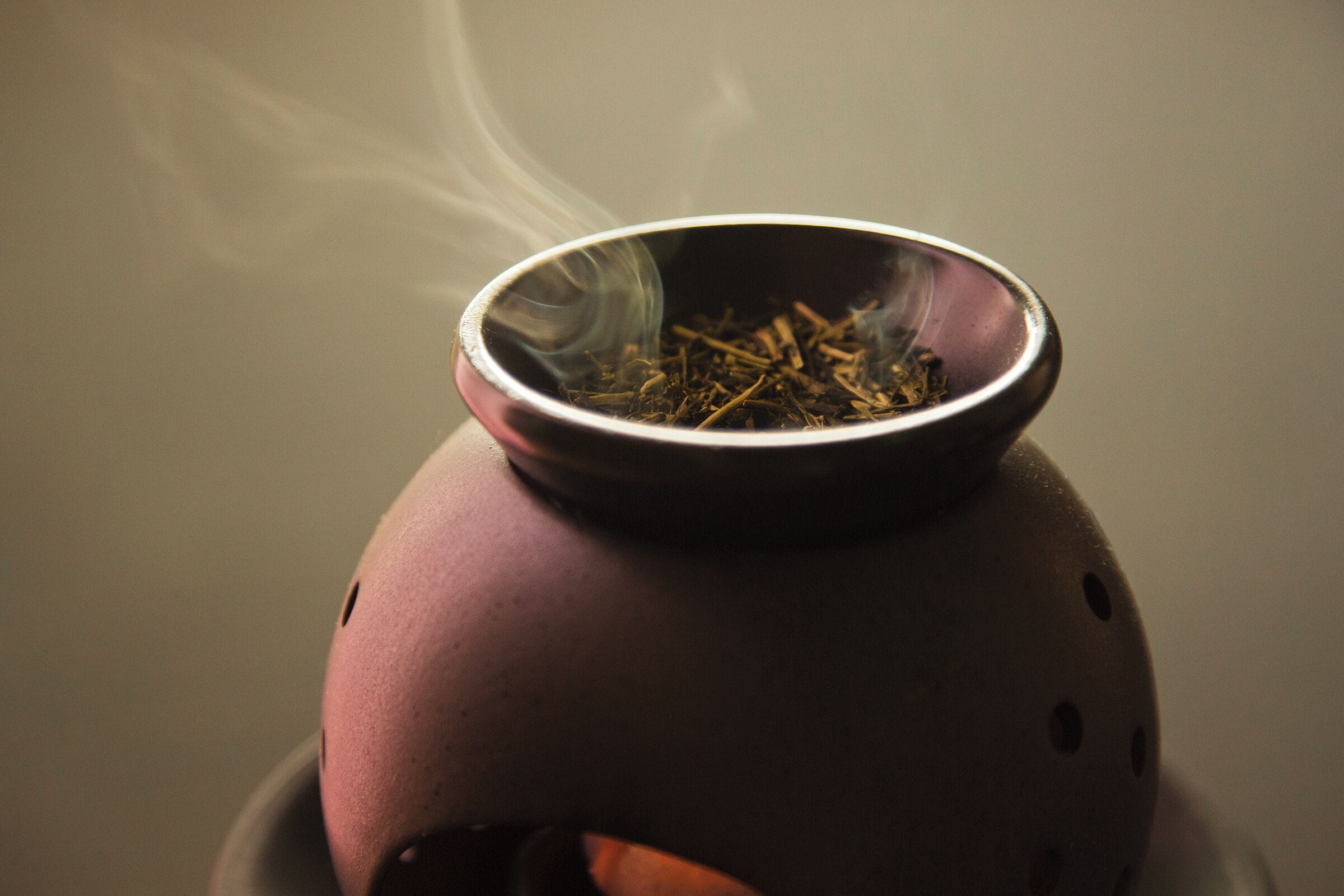 A smoking bowl on a ceramic pot.