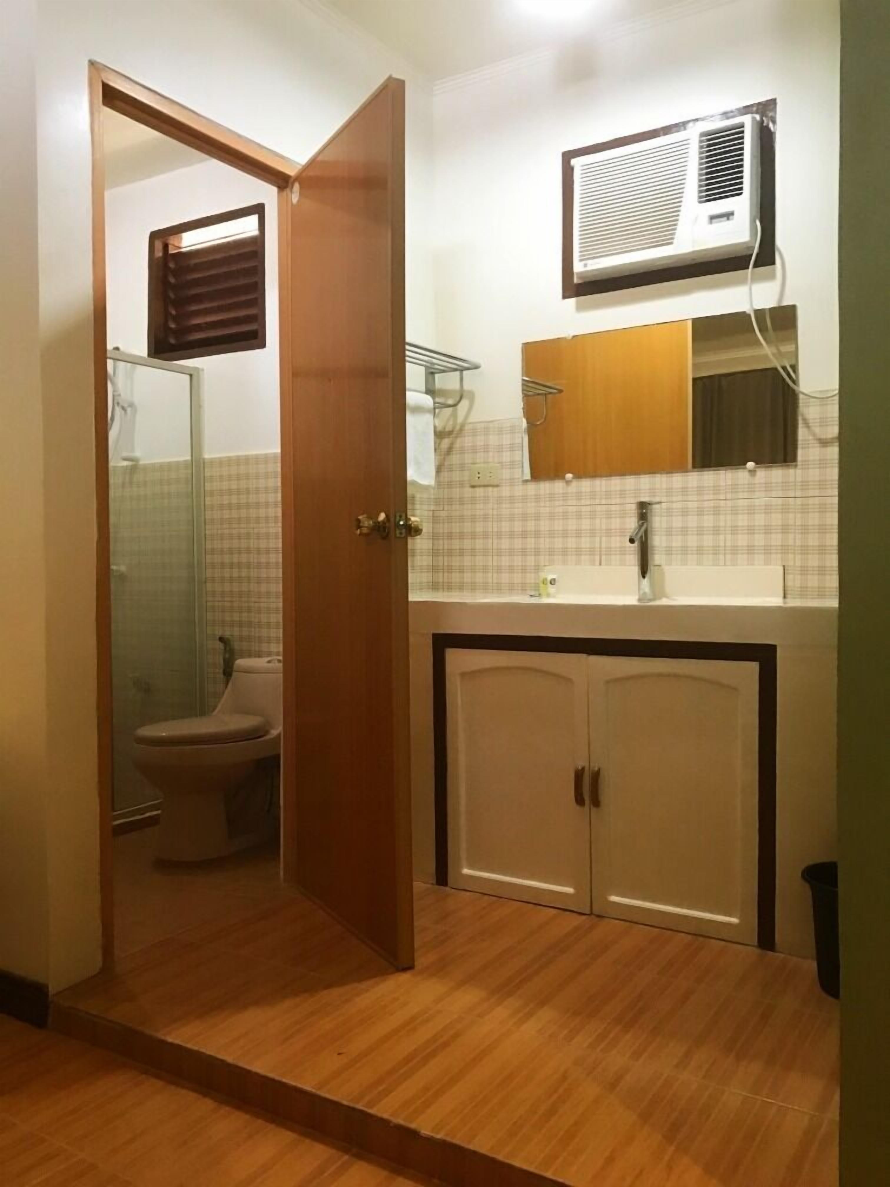 deluxe room, 2 queen beds | bathroom | shower, free toiletries, bidet, towels