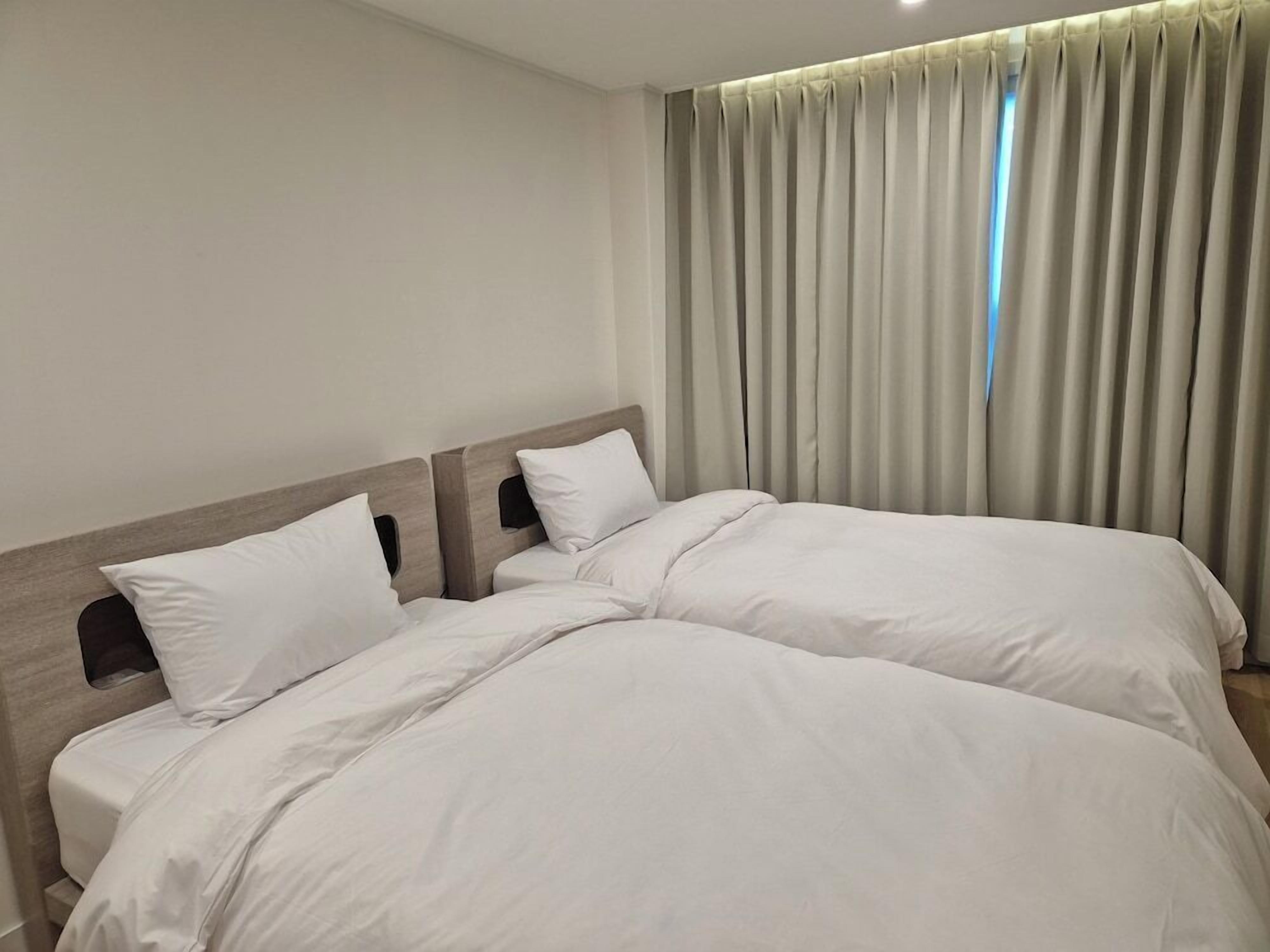 Premium bedding, down comforters, blackout drapes, soundproofing