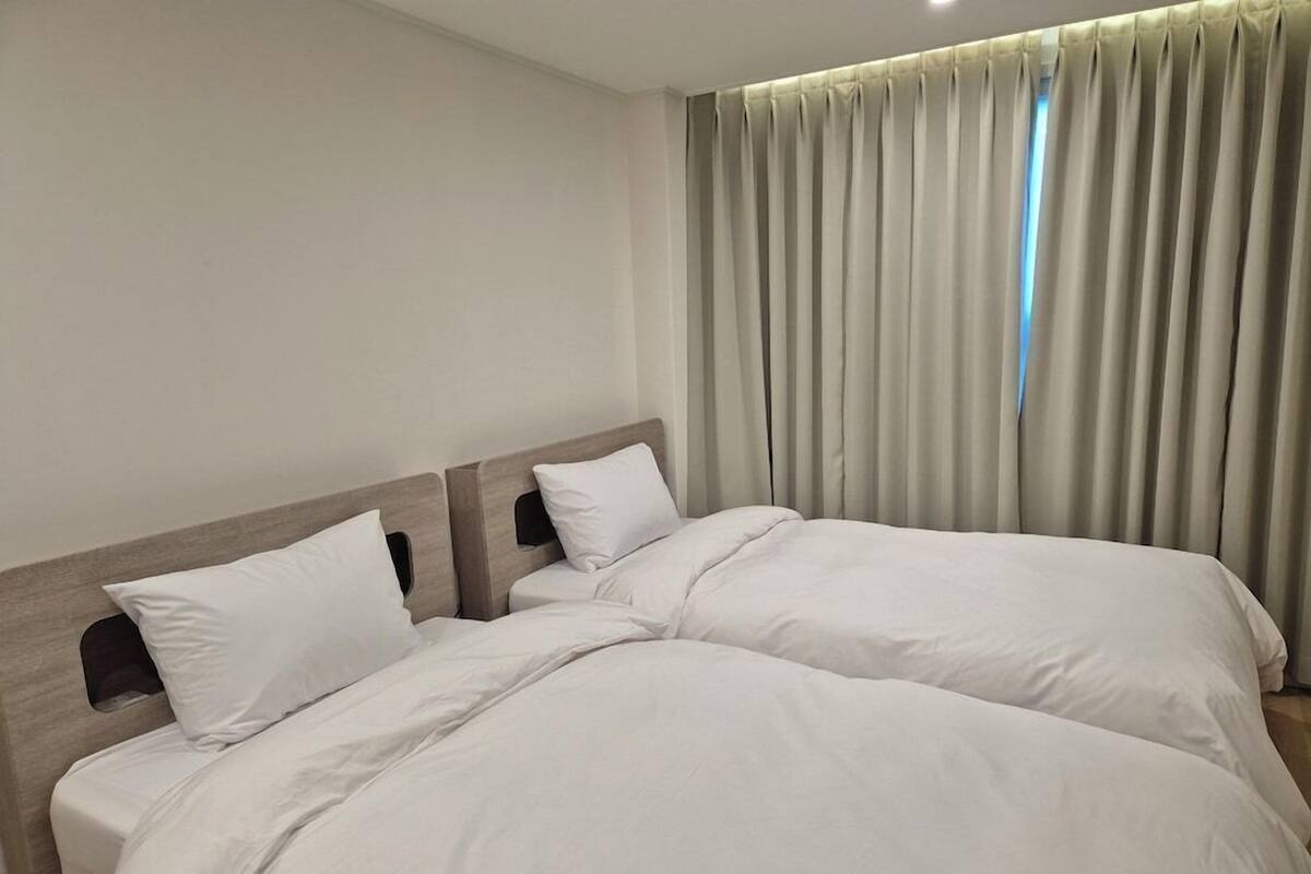 Premium bedding, down comforters, blackout drapes, soundproofing