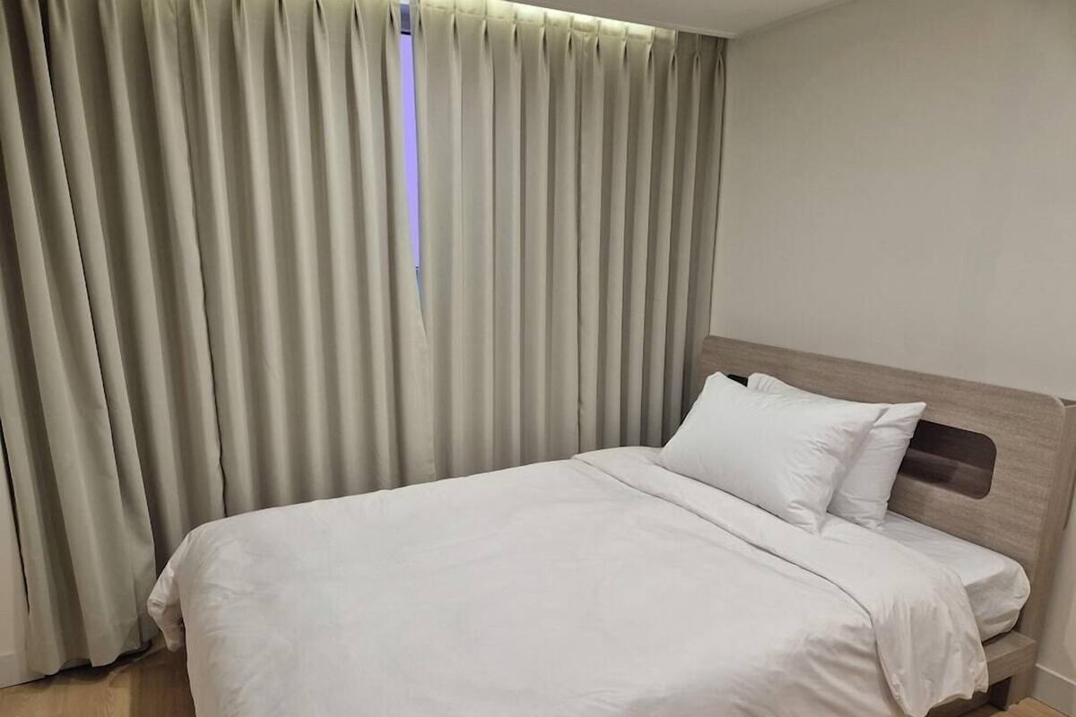 Premium bedding, down comforters, blackout drapes, soundproofing