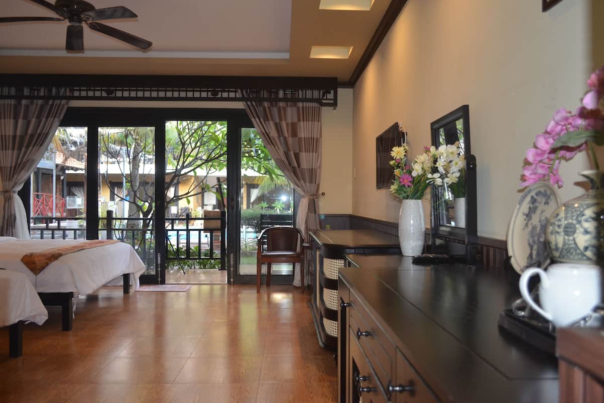 Superior Twin Room, 2 Queen Beds, Pool View | Minibar, in-room safe, desk, soundproofing