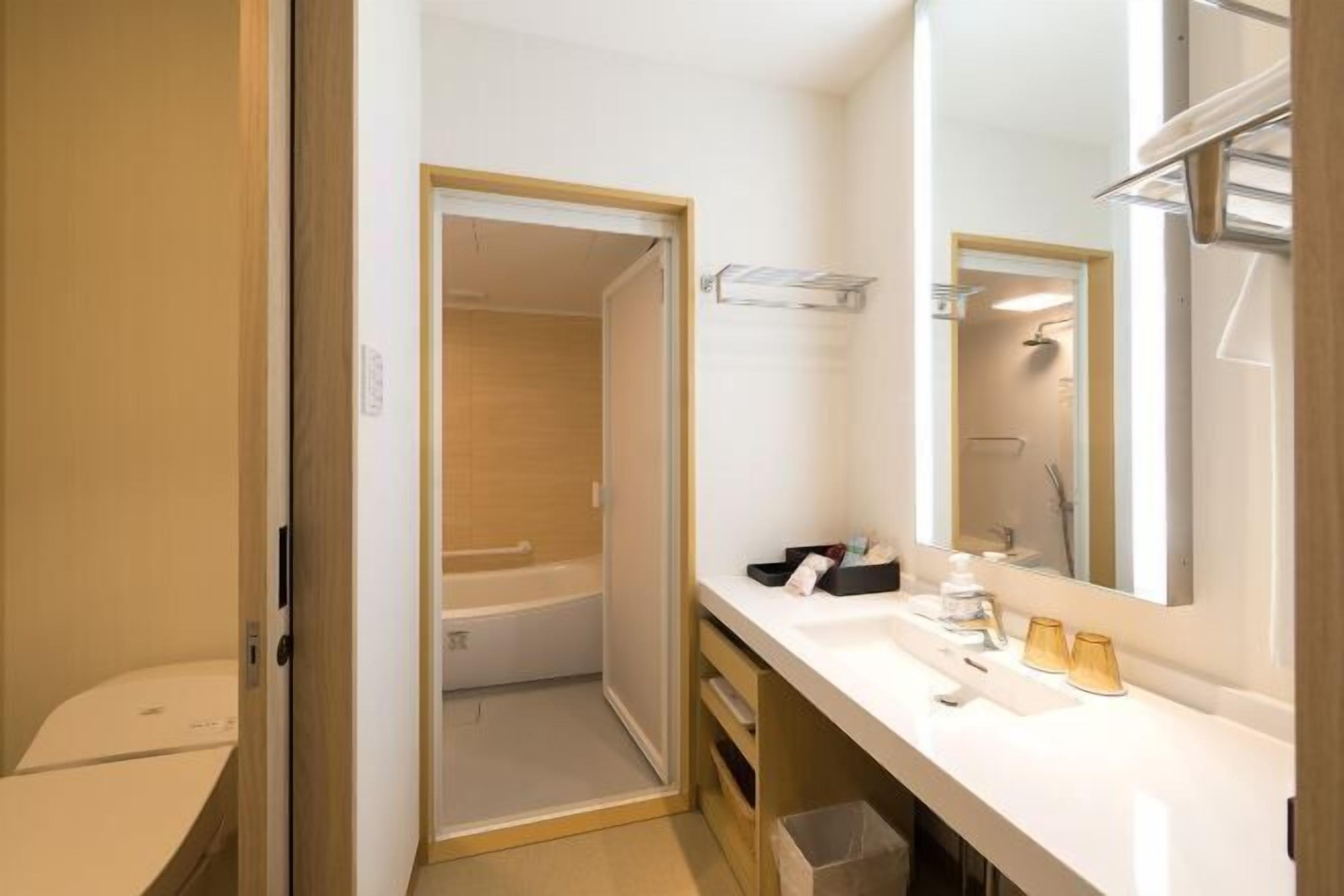 Shower, free toiletries, hair dryer, slippers