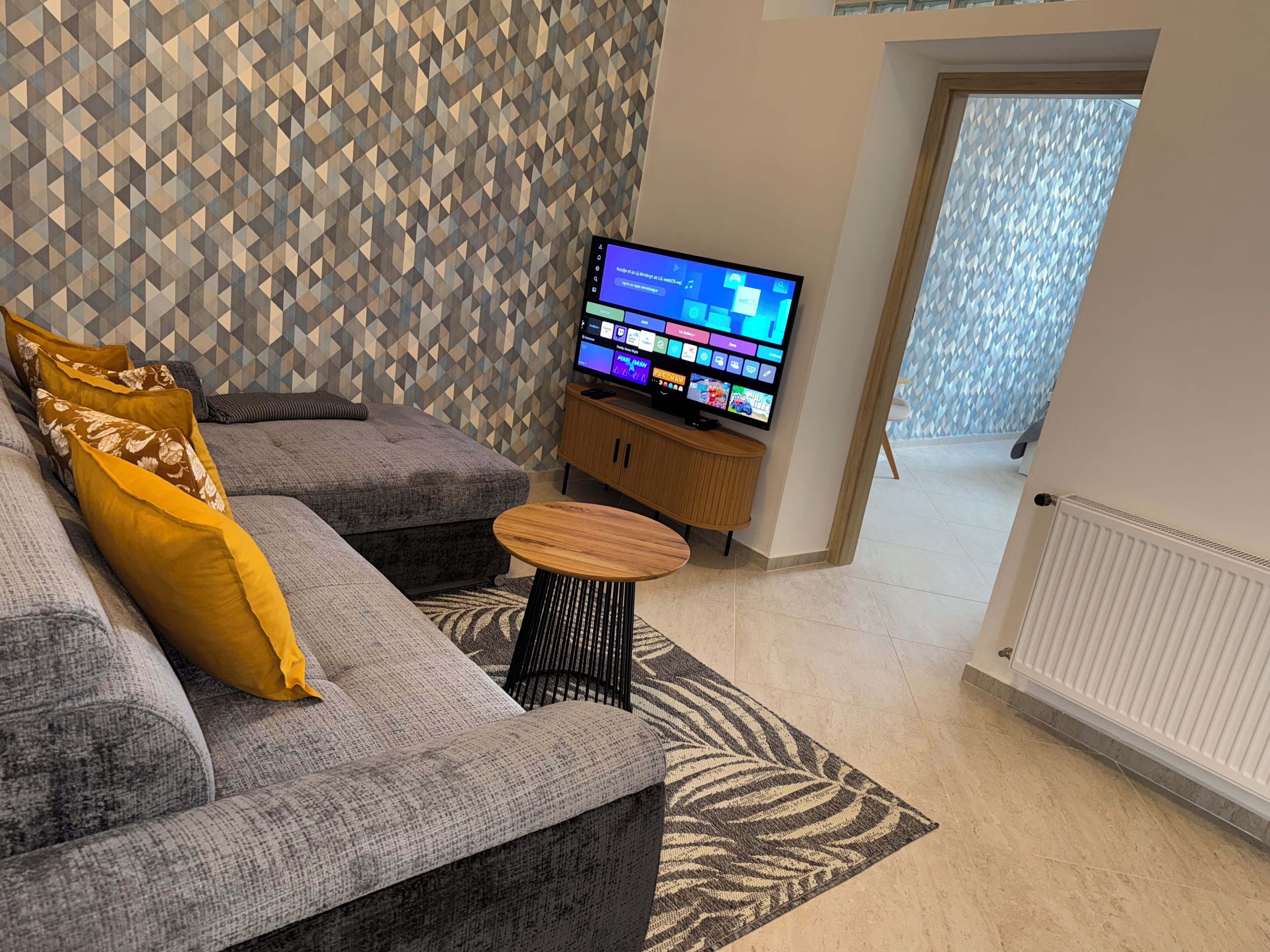 Appartement | Coin séjour | TV connectée de 50 pouces avec chaînes par câble, télévision, Netflix