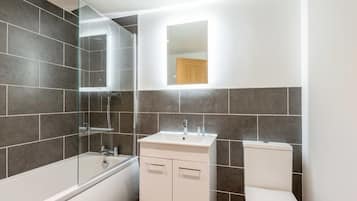 Shower, hair dryer, towels, shampoo