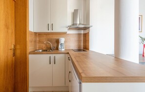 Fridge, oven, coffee/tea maker, cookware/dishes/utensils
