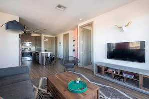 Apartment | Living area | 42-inch Smart TV with digital channels, streaming services - TWO Modern CozySuites at Town Lake Waterfront (Tempe)