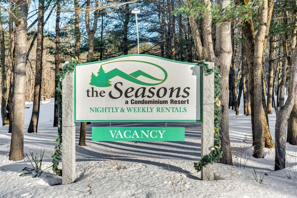 A sign for "The Seasons" condominium resort with a vacancy notice. - Inviting Bartlett Condo: 1 Mi to Attitash Mountain (Bartlett)