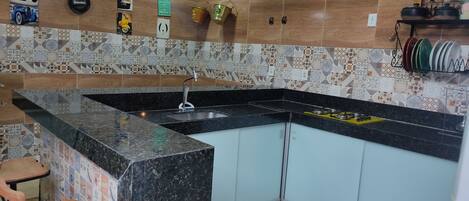 Fridge, stovetop, blender, cookware/dishes/utensils