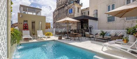 Outdoor pool, open 7:30 AM to 7:00 PM, pool umbrellas, pool loungers