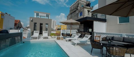 Outdoor pool, open 7:30 AM to 7:00 PM, pool umbrellas, pool loungers