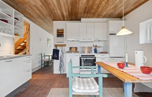 Fridge, stovetop, dishwasher, coffee/tea maker