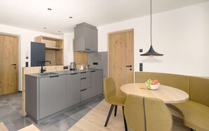 Fridge, stovetop, dishwasher, coffee/tea maker