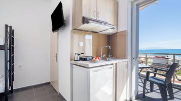 Fridge, stovetop, electric kettle, high chair