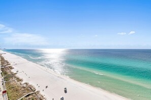 On the beach, sun loungers, beach towels