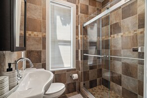 Shower, hair dryer, towels, soap